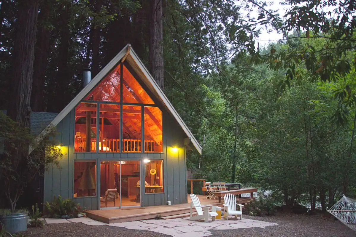 A frame cabin wood stone patio