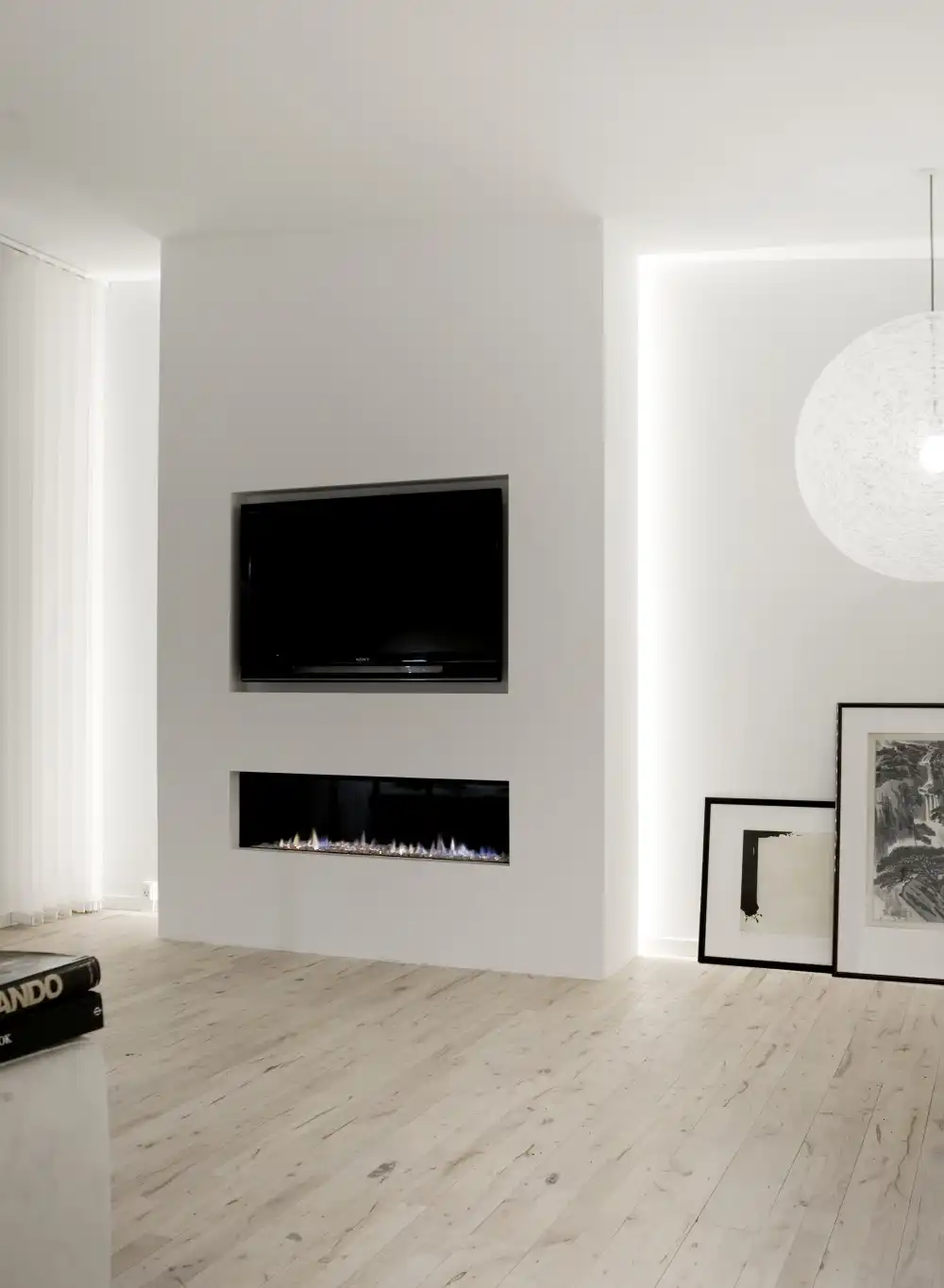 A modern fireplace and TV wall