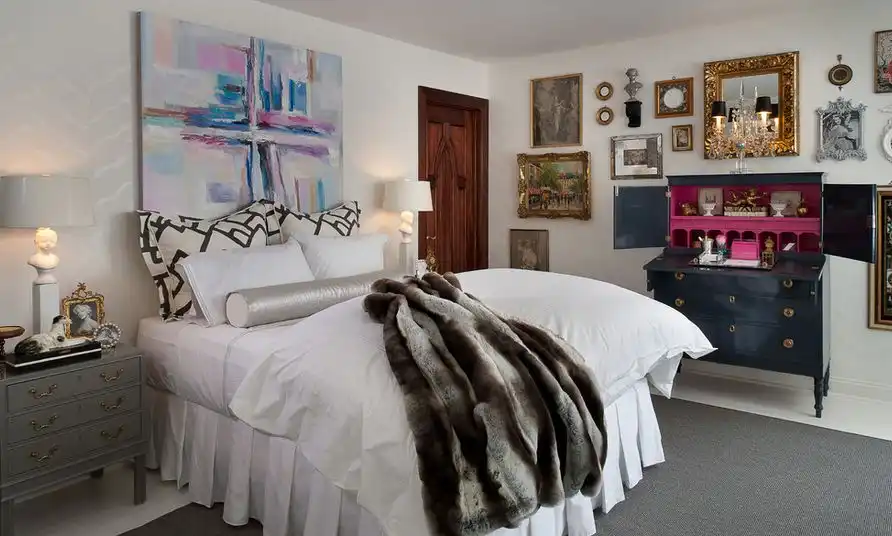 Abstract canvas art above the bed