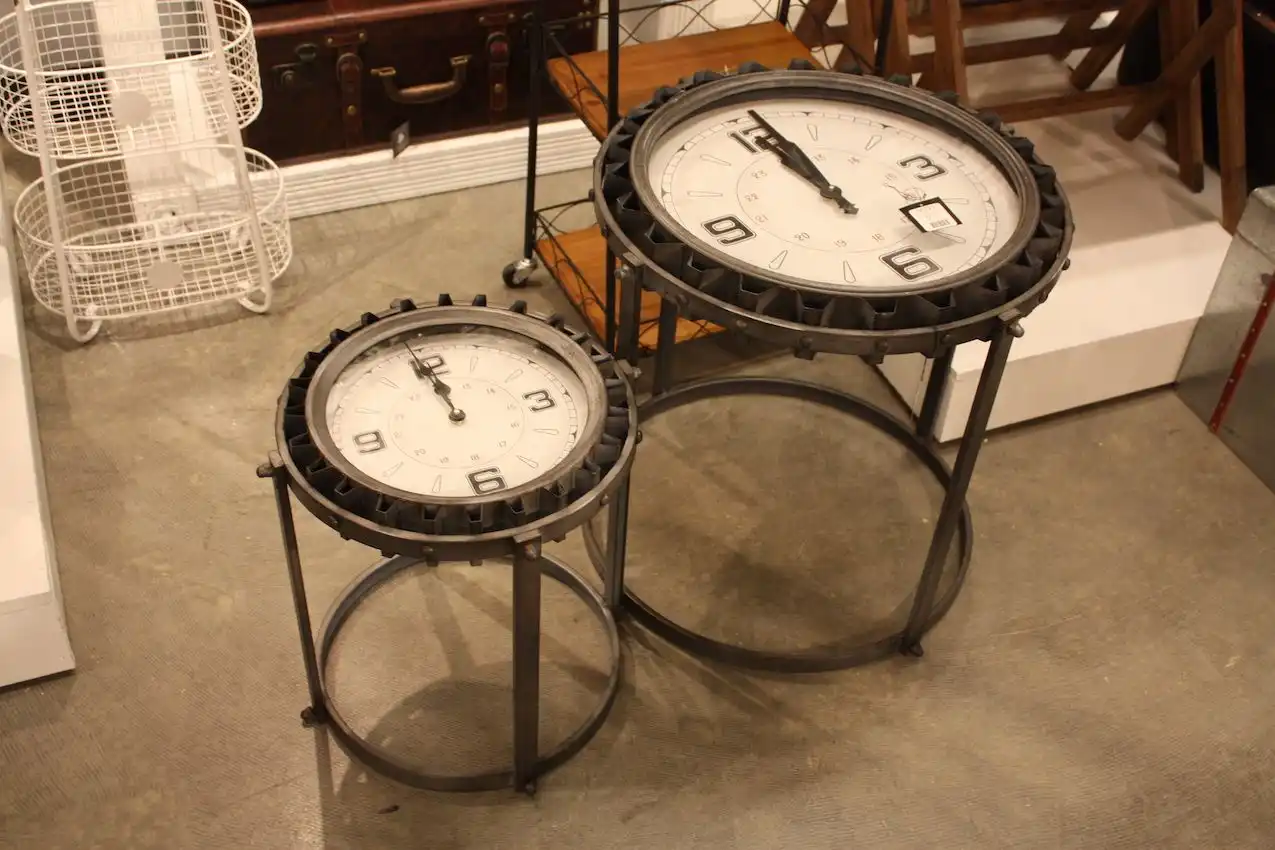 These accent table combine gears, vintage clock faces and plenty of metal.