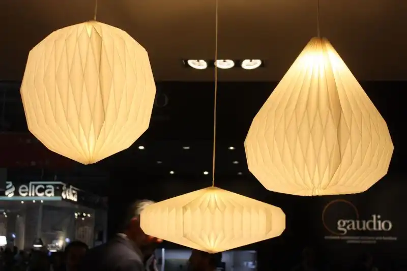 A closer look reveals the accordion folds of these pendant fixtures.
