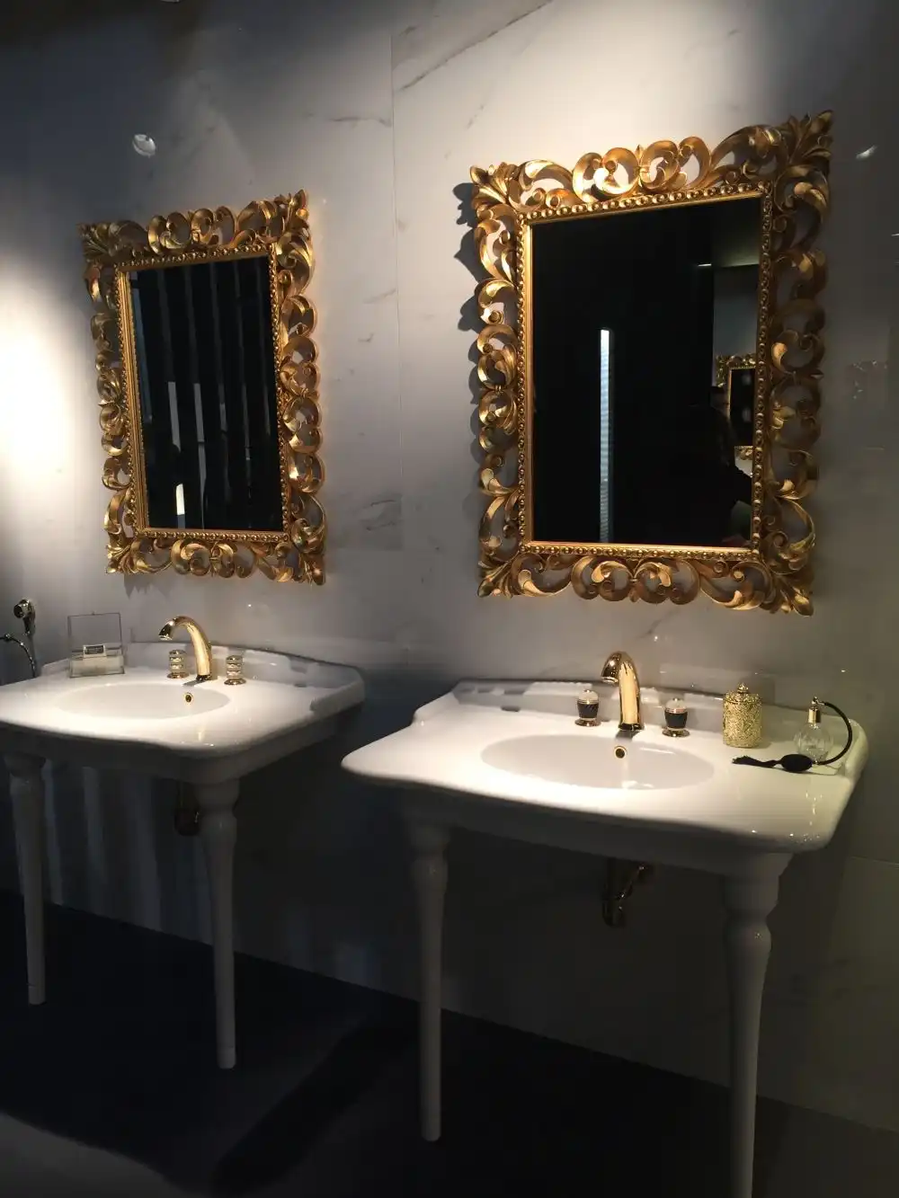 Add a luxury feel to the bathroom with gold mirrors