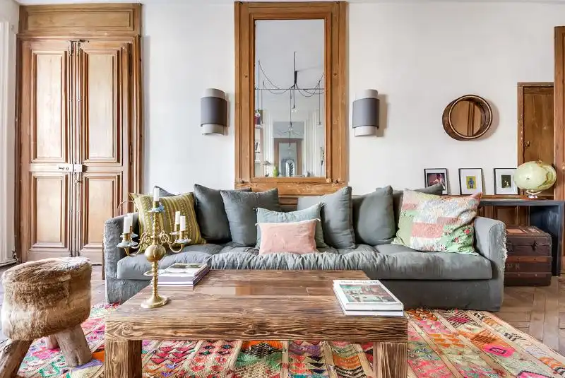 Add color to living room through pillows and carpet