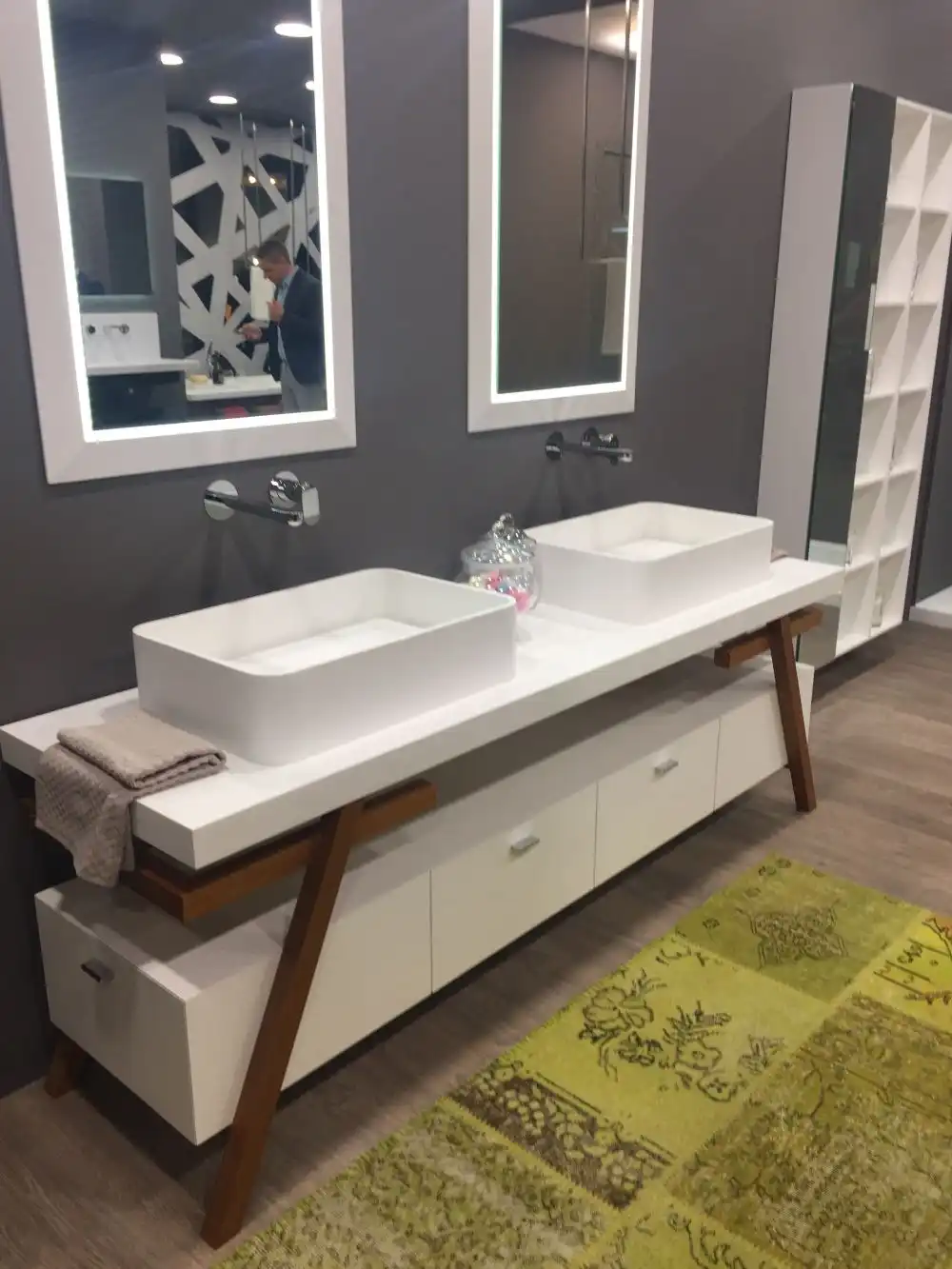 Add warm to a gray bathroom with wood accents