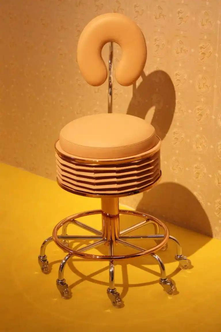 Reminiscent of a doctor's rolling chair, this one is far more luxurious.