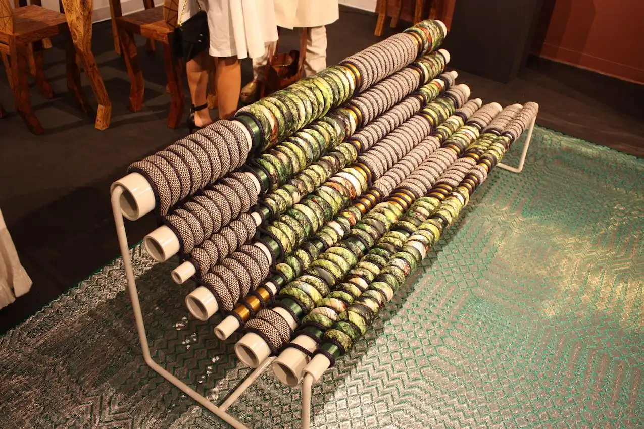 Powder-coated aluminum pipes, steel, marine rope and upholstery fabric, make up this bench, made in 2016.
