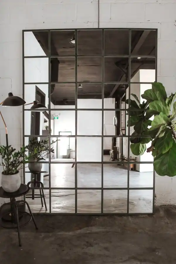 An oversized industrial mirror