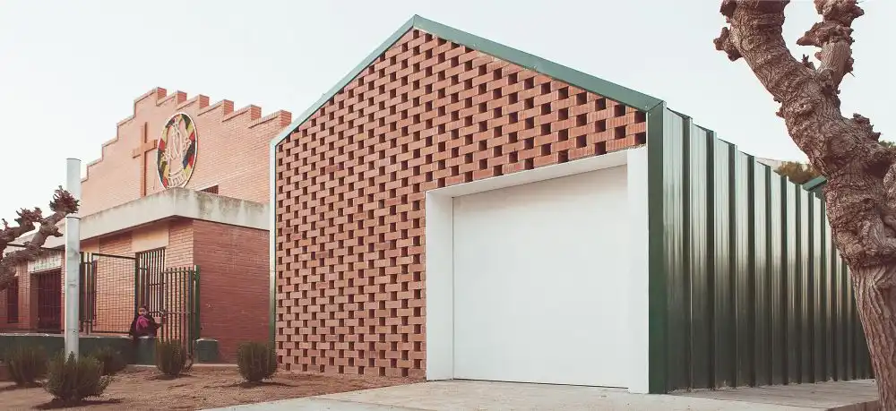 Angle Perforated and stacked bricks facade - NUA Arquitectures