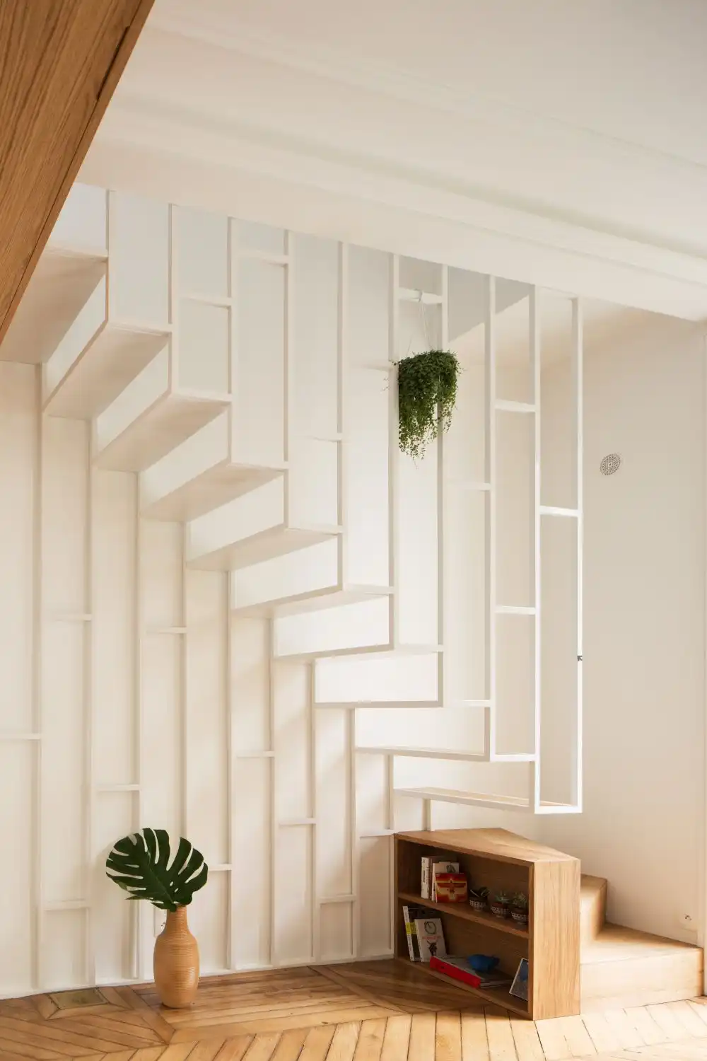 Apartment with hanging whtie steel frame