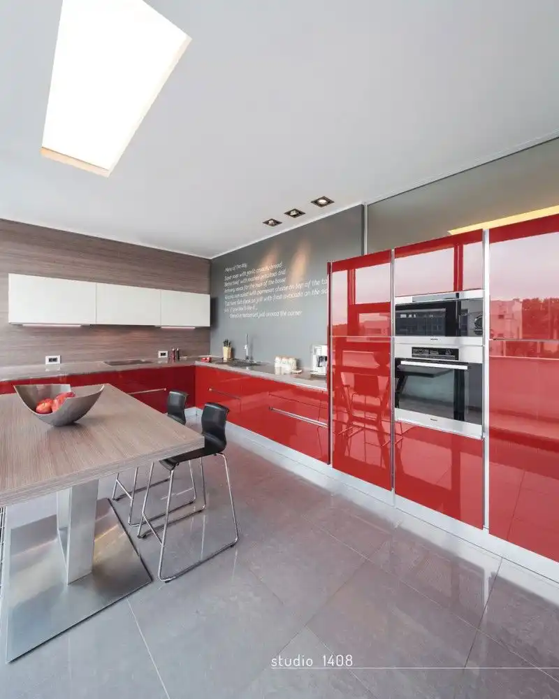 Apartment with large red kitchen cabinets