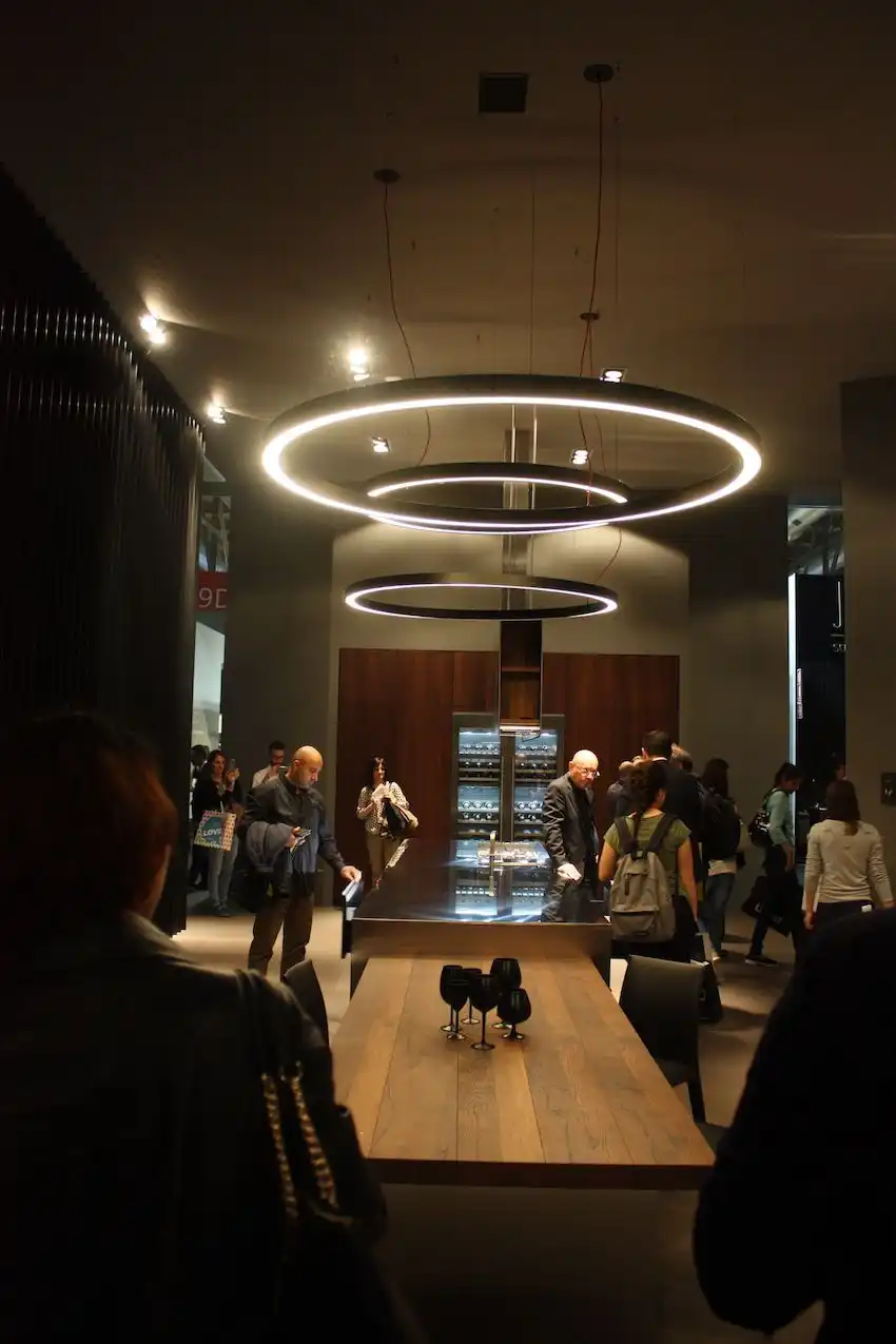 Arrital made quite a statement by using these LED ring lights in a line to illuminate not only the dining table but also the kitchen island.