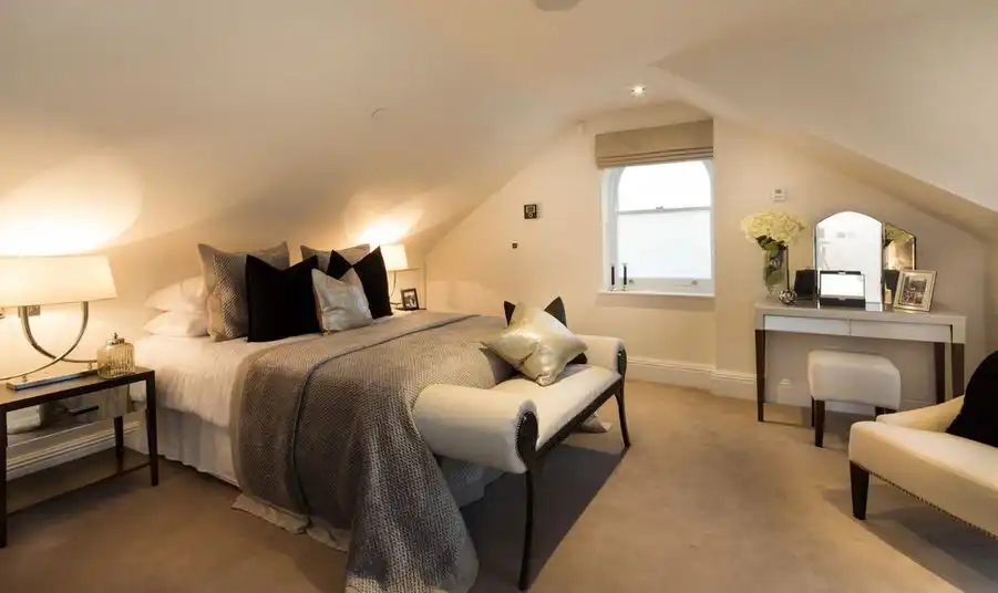 Attic bedroom featurinf a dressing table