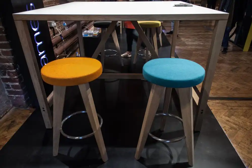 Backless colorful stool with felt seat in orange and blue