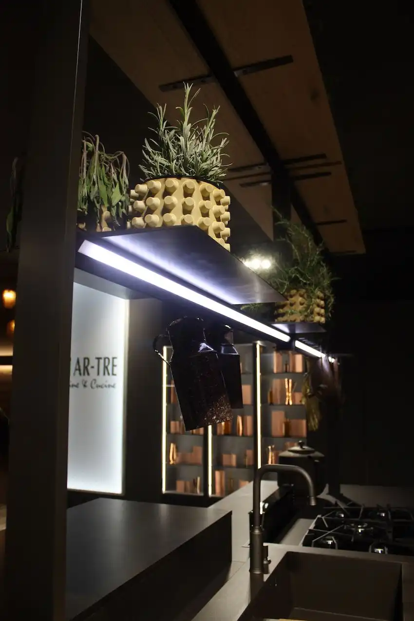 This bar light fixture on an Ar-Tre display is some serious kitchen island lighting. It provides good task illumination from underneath the shelf, eliminating the need for another hanging element.
