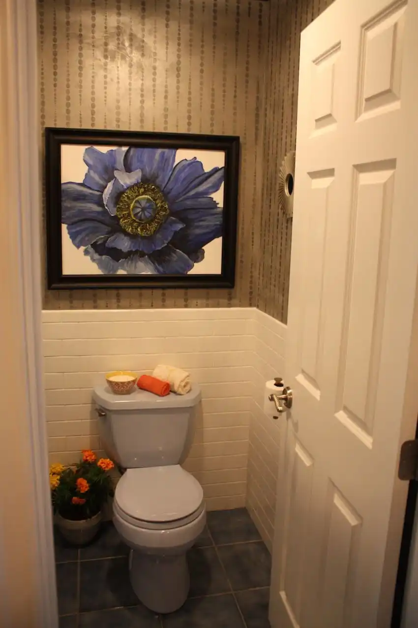 Bathroon toilet room with wall art above