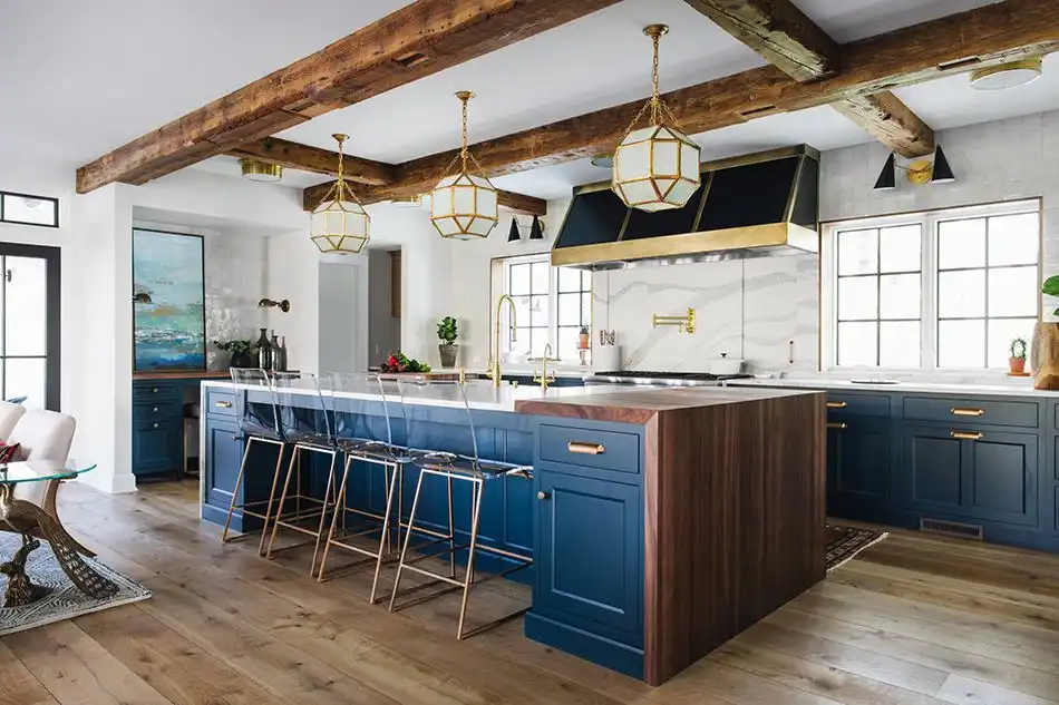 Beautiful kitchen with wood beams and dark blue lower cabinets