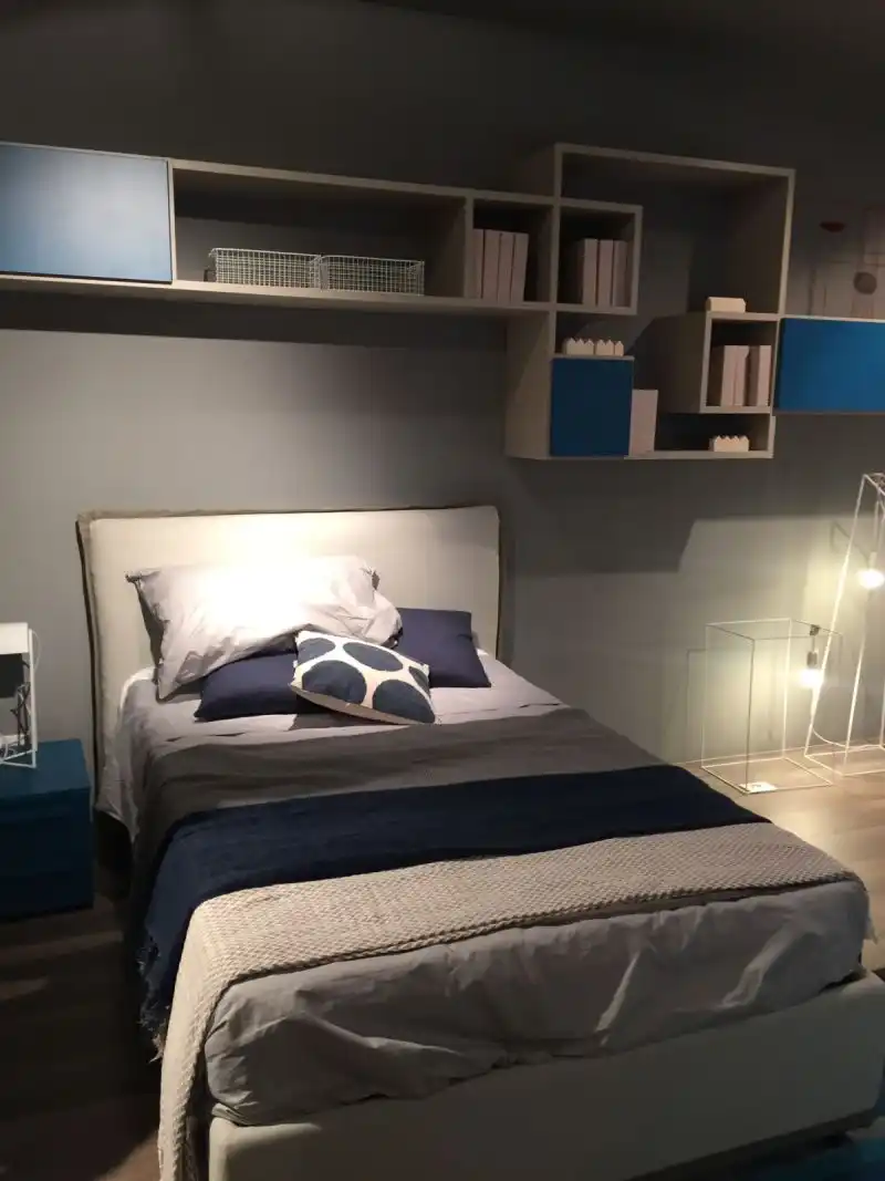 Bed and shelves above