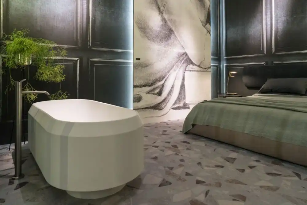 Bedroom featuring a modern curved bathtub