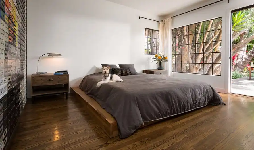 Bedroom with a platform bed and hardwood floor