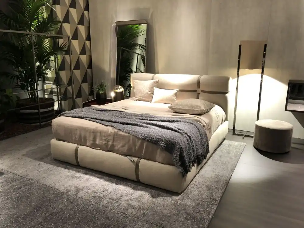 Bedroom with modern floor mirrors and gray bed