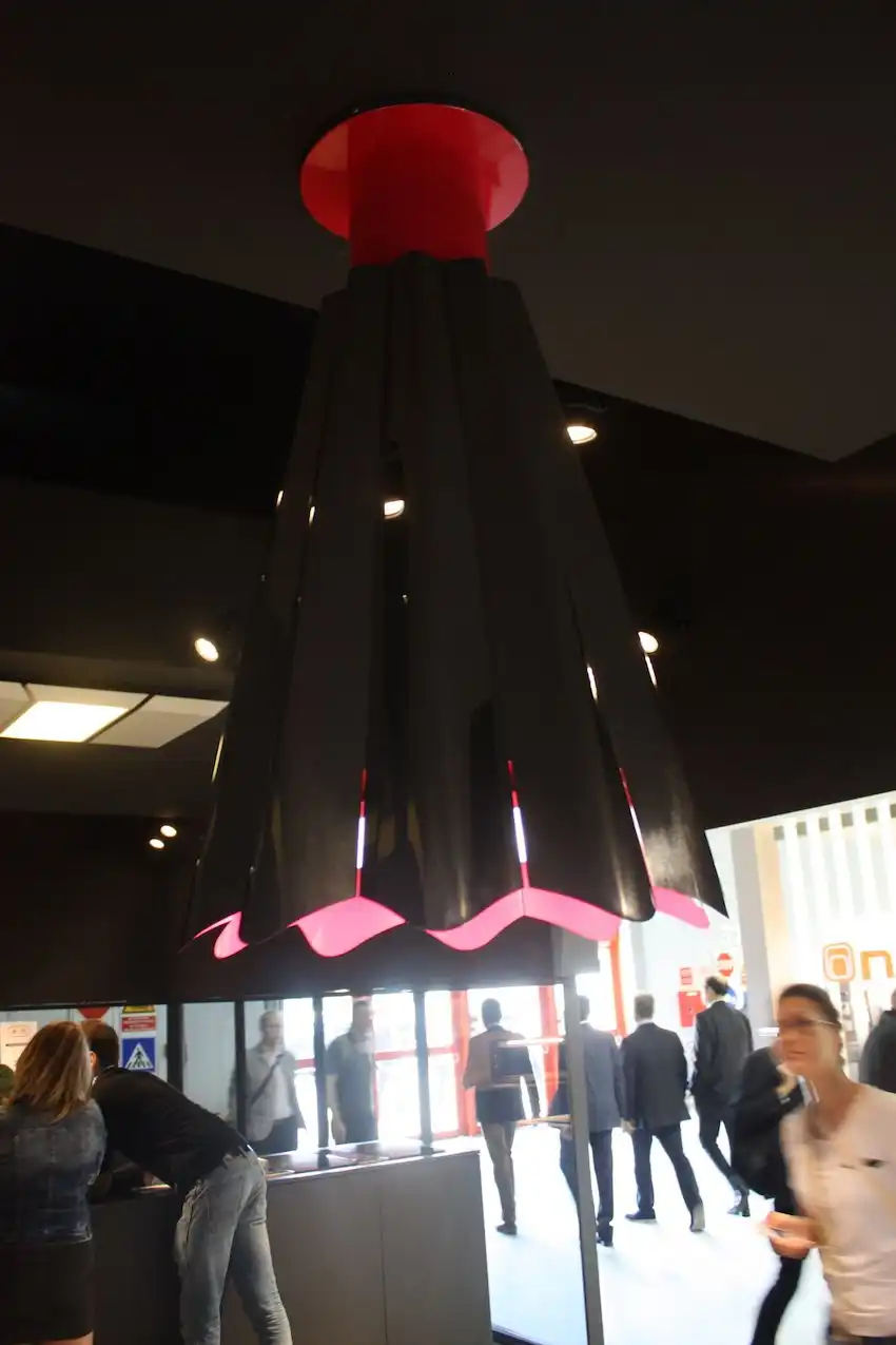 Pink in the kitchen! Best Range Hoods displayed this ceiling-mounted kitchen light fixture that goes from dark to a bit dainty thanks to the pink interior.