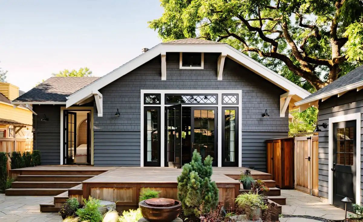 Black Door With White Trim and Gray Siding