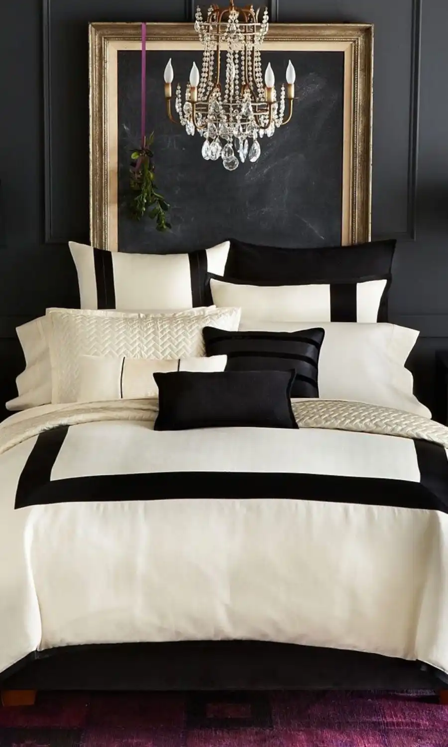 Black and gold bedroom decor with a large emptu frame headboard