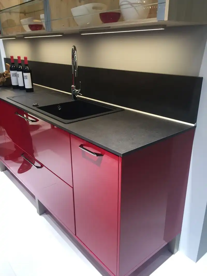 Black countertop and deep purple cabinet