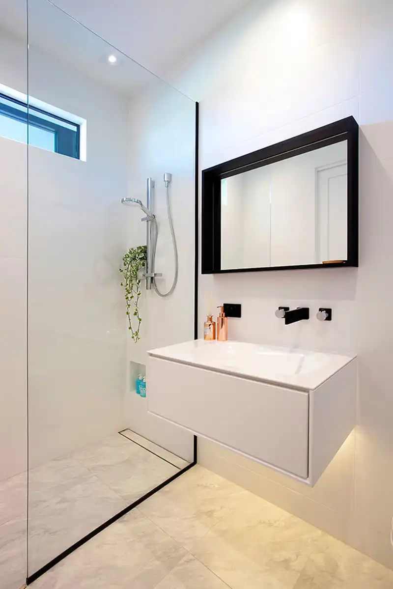 Black frame shower glass and lower niche