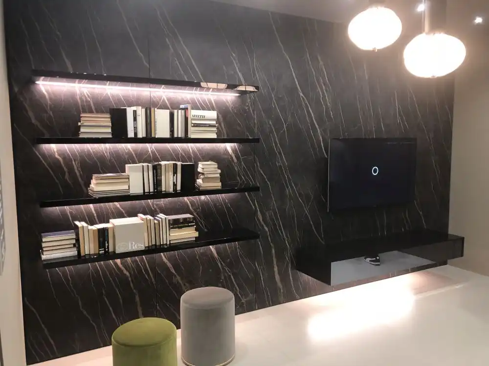 Black marble wall with floating shelves and Tv on the console
