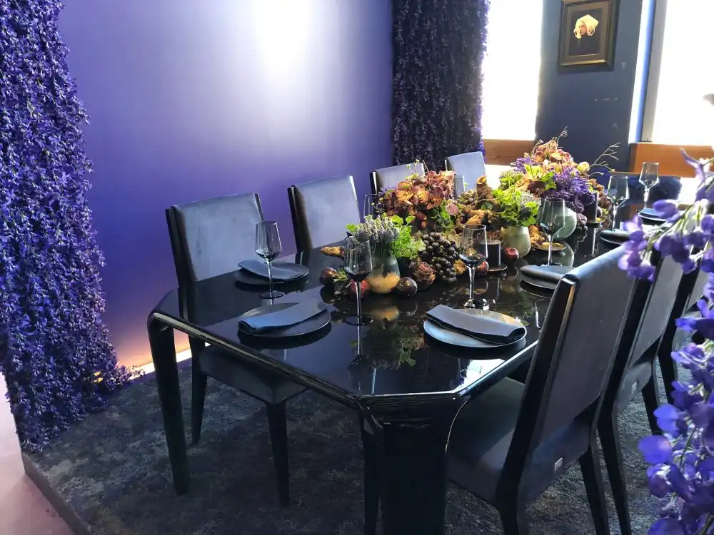 Black minimalist dining table with dried fruits on top