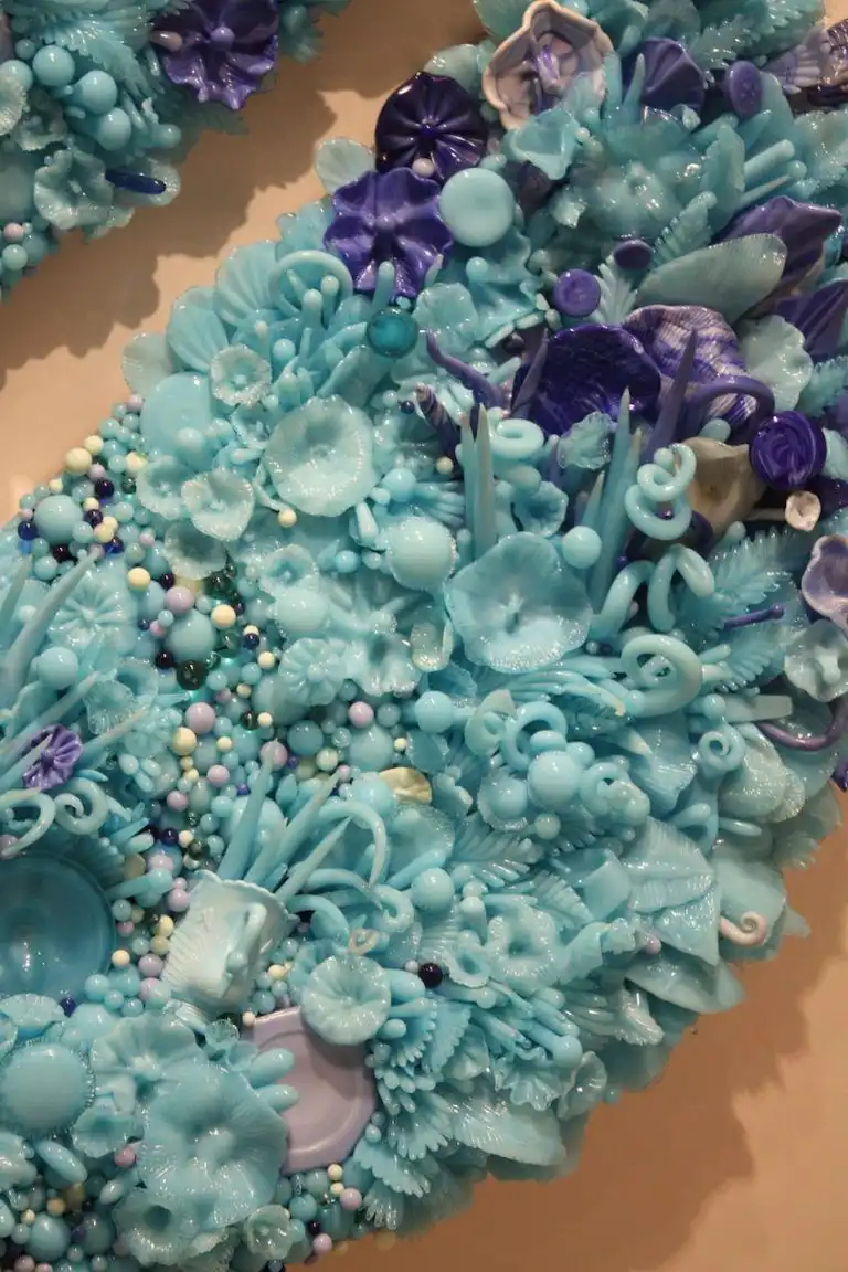 A closer look at the tiny flowers, balls and leaves that comprise this piece.