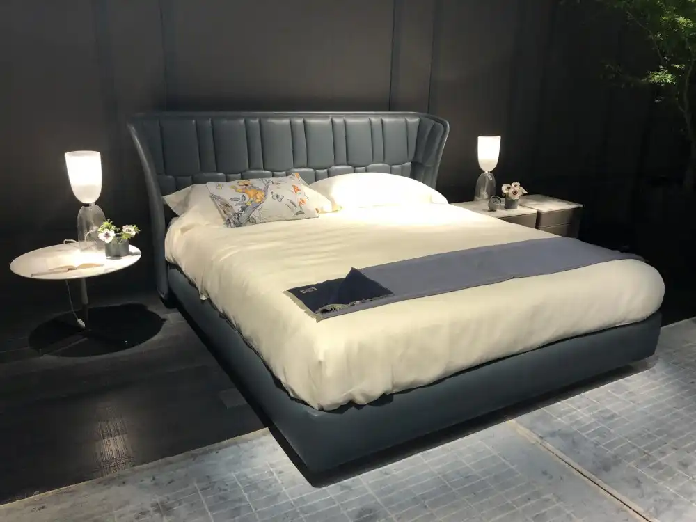 The bed is the centerpiece of the room so embrace that and make it stand out
