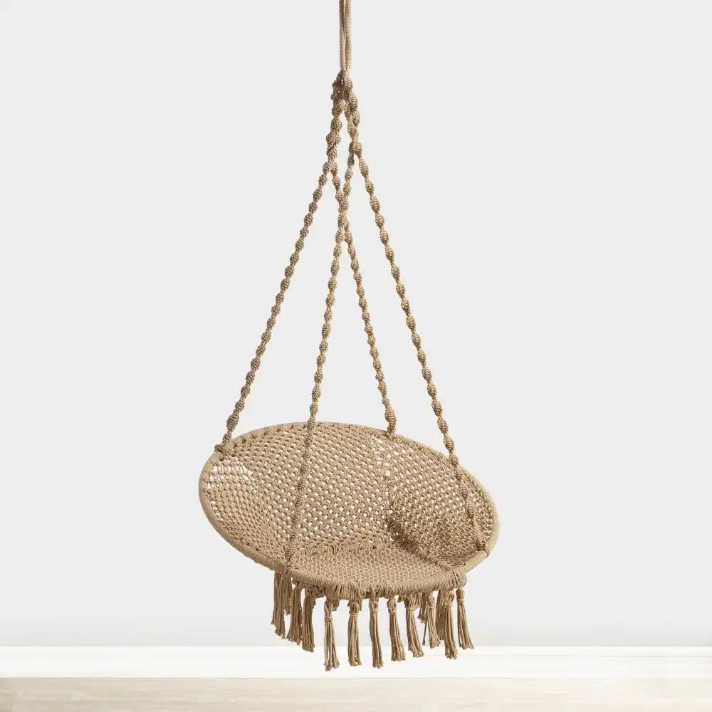 Boho bedroom with hanging accent chair
