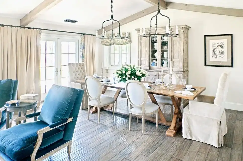 Boho style open space living room with dining table trestle style