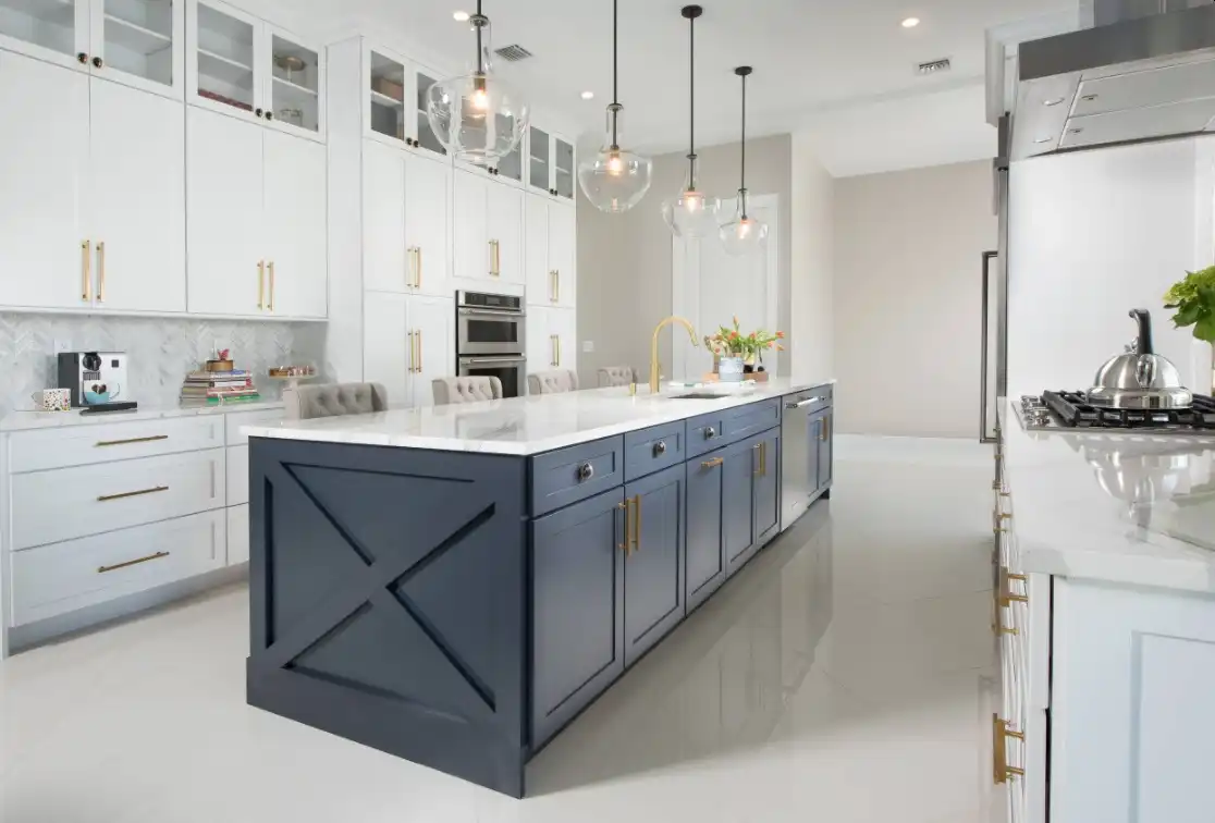 Brass kitchen hardware blue island and white cabinets