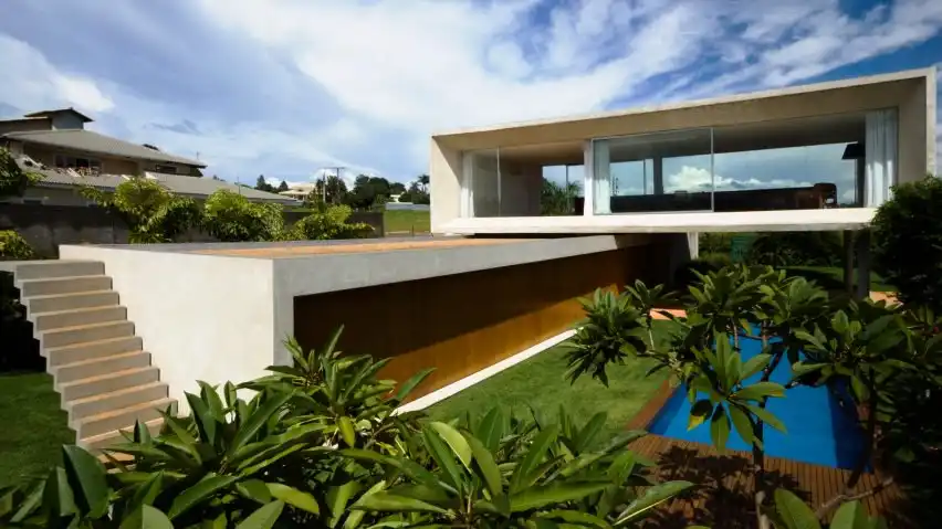 Both volumes are long and rectangular. A staircase along the bottom one offers access to a roof terrace