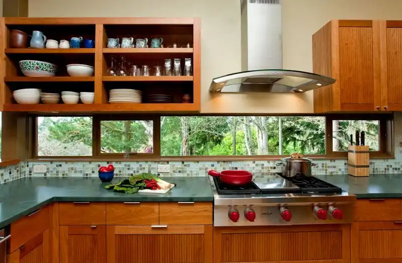 Brown kitchen with countertop backsplash and window above