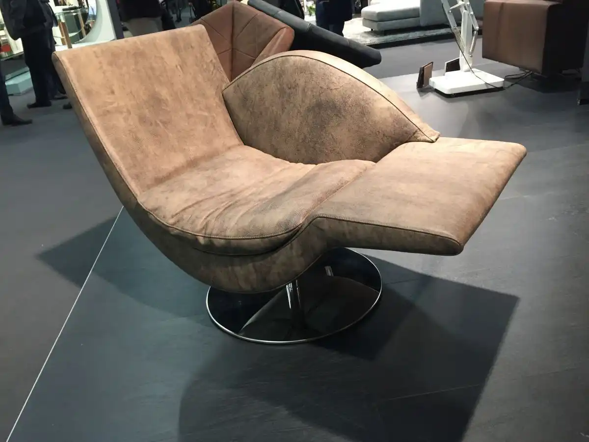 This brown leather chaise is quite masculine and has a modern shape.