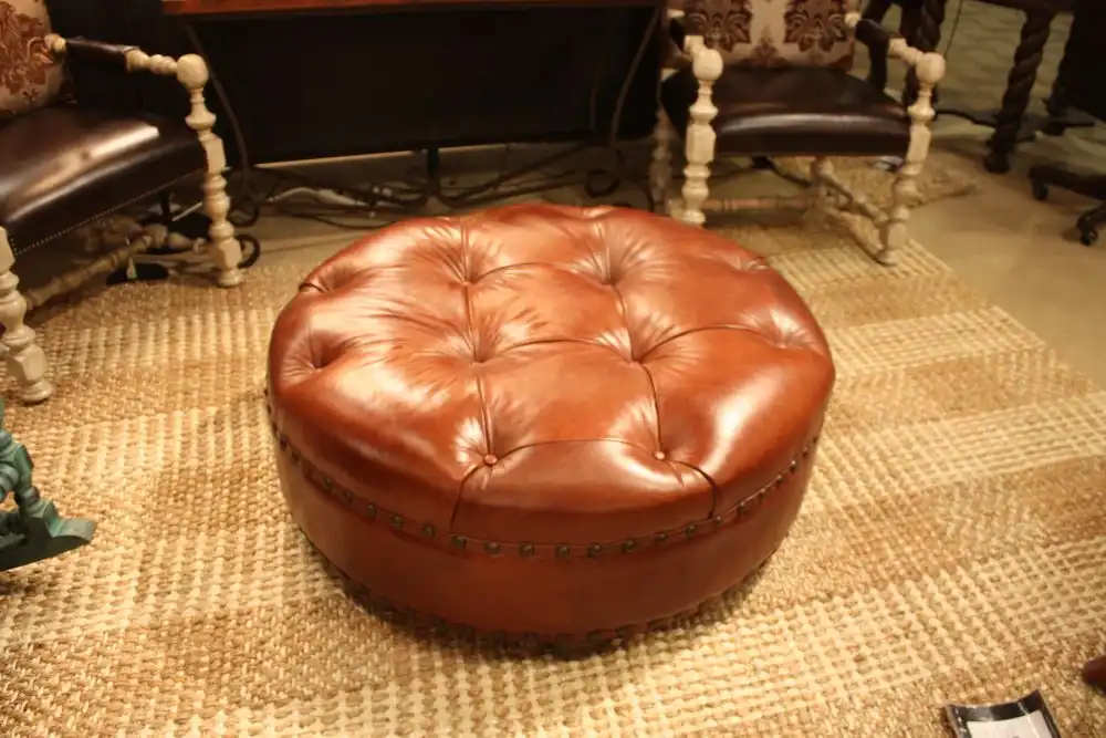Brown leather tufted ottoman