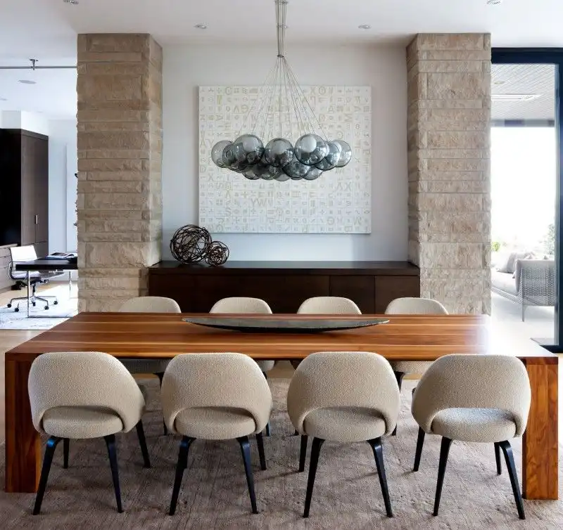 industrial loft dining area with a collection of framed pictures