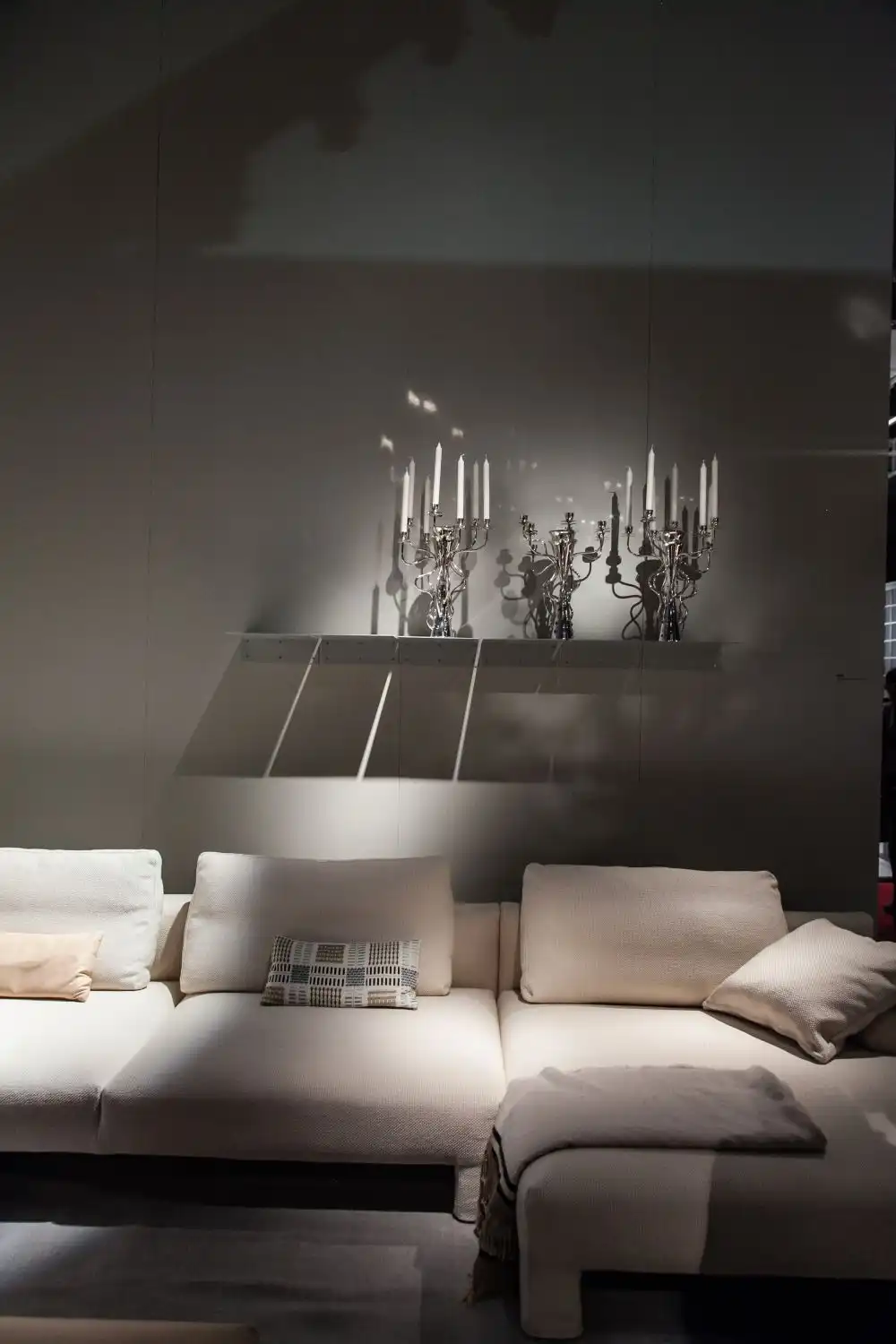 Open shelves are often used as display surfaces for decorative items such as candles, vases, even planters