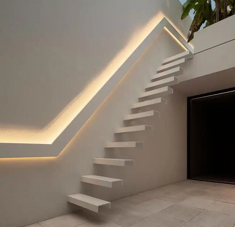 Cantilevered stairs with backlit handrail