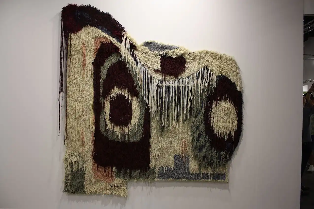 This artist's pieces include wool wall-hangings, drawings and paintings.