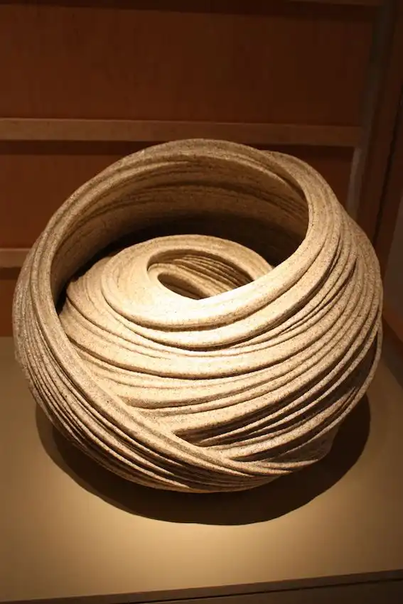 The stoneware has a sand glaze that further ties the piece to the sea.