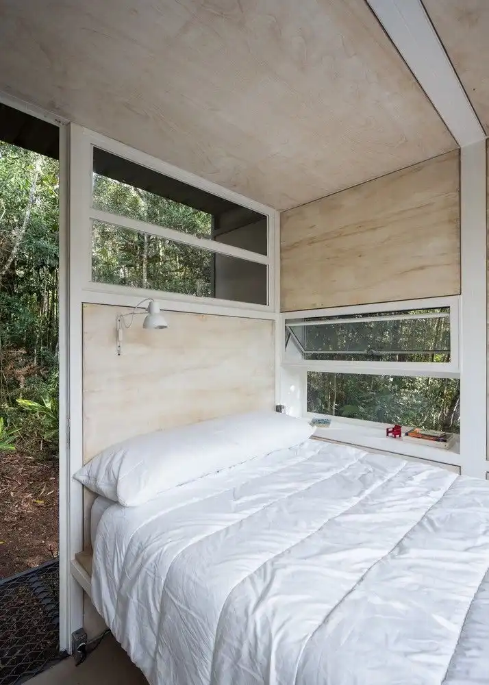Chalet L plywood interior by Silvia Acar Arquitetura - bedroom