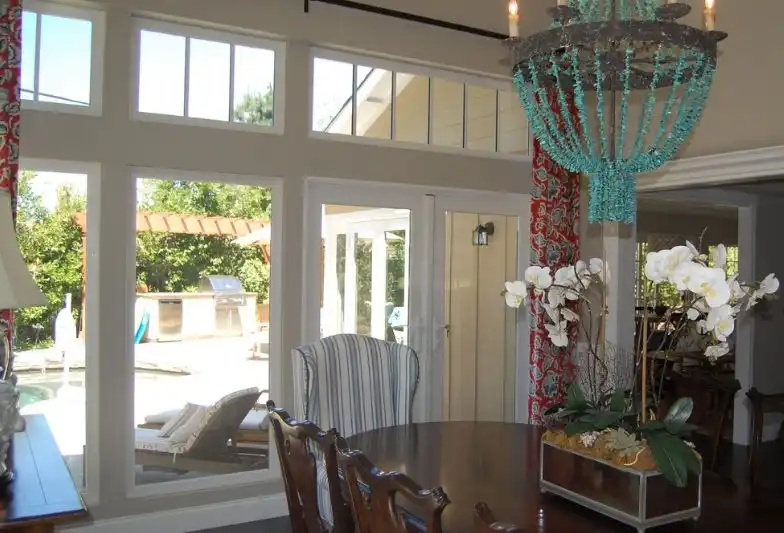Chandelier with beaded design over dining table