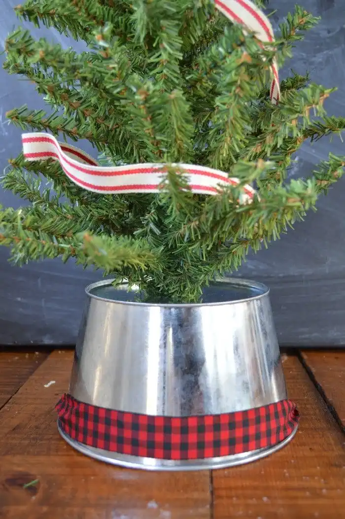 Upside down bucket as a skirt for the tree