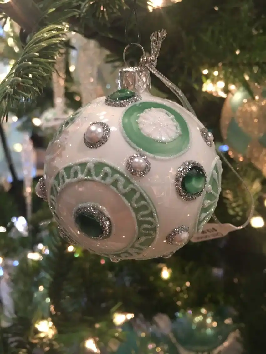 A bejeweled ceramic ball sports glitter as well as color.