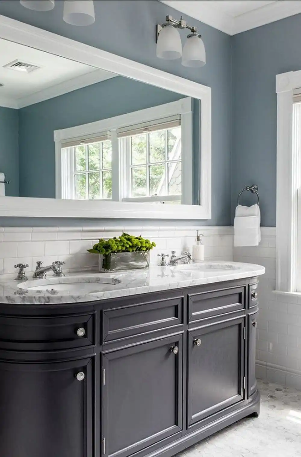 Classic bathroom with blue walls and deep dark vanity